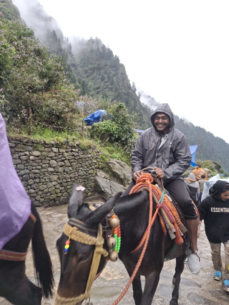 Pilgrims Riding Horses on The Kedarnath Trek With Himalayan Mountain Views