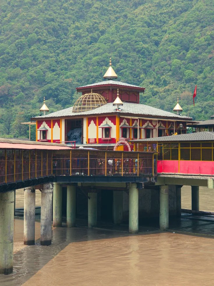 Dhari Devi Temple on the Alaknanda River in Uttarakhand during a Char Dham Yatra return journey.
